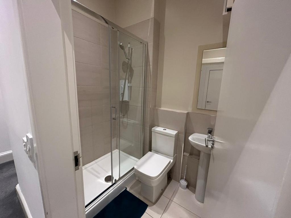 Contemporary bathroom with shower and clean des...