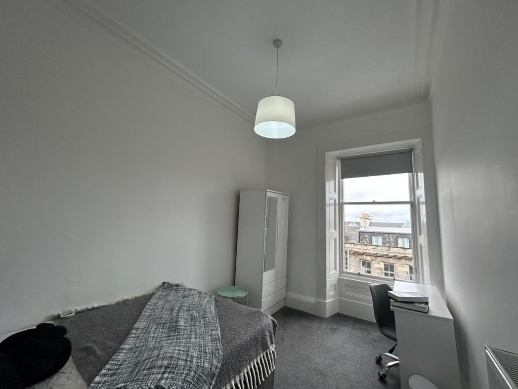 Bright room with large window and wardrobe...