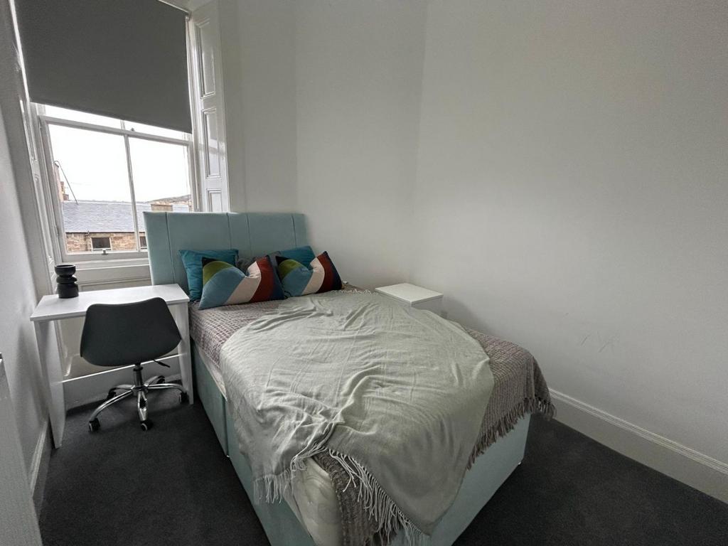 Bright bedroom with comfy double bed and desk...