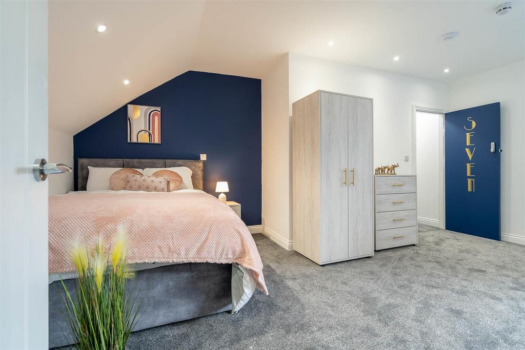 Bright, stylish double bedroom with wardrobe sp...