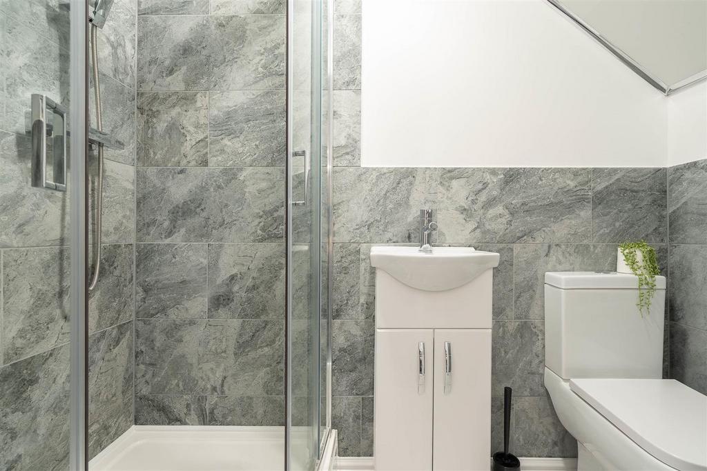 Modern bathroom with walk-in shower and vanity...