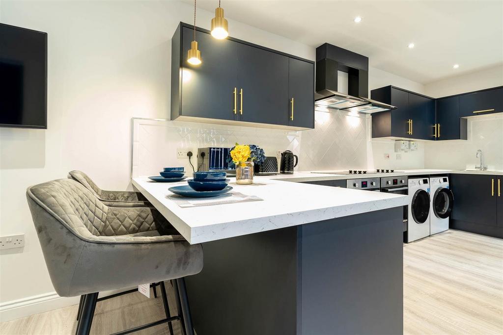 Modern open-plan kitchen with breakfast bar...