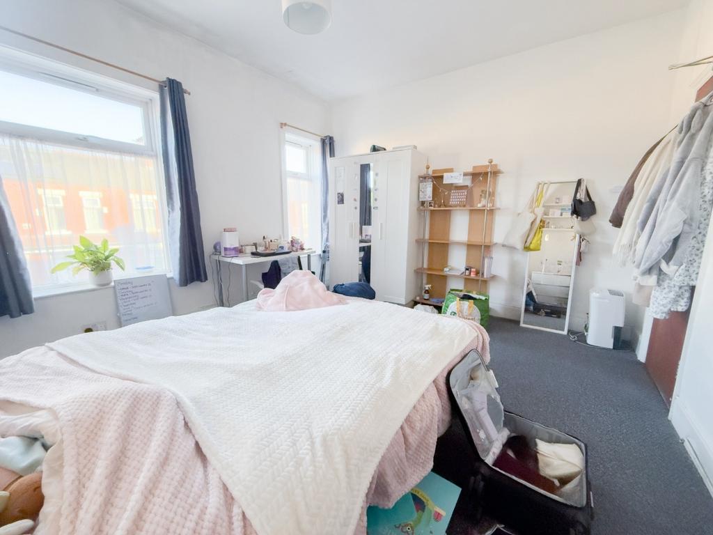 Bright, furnished bedroom with study area...