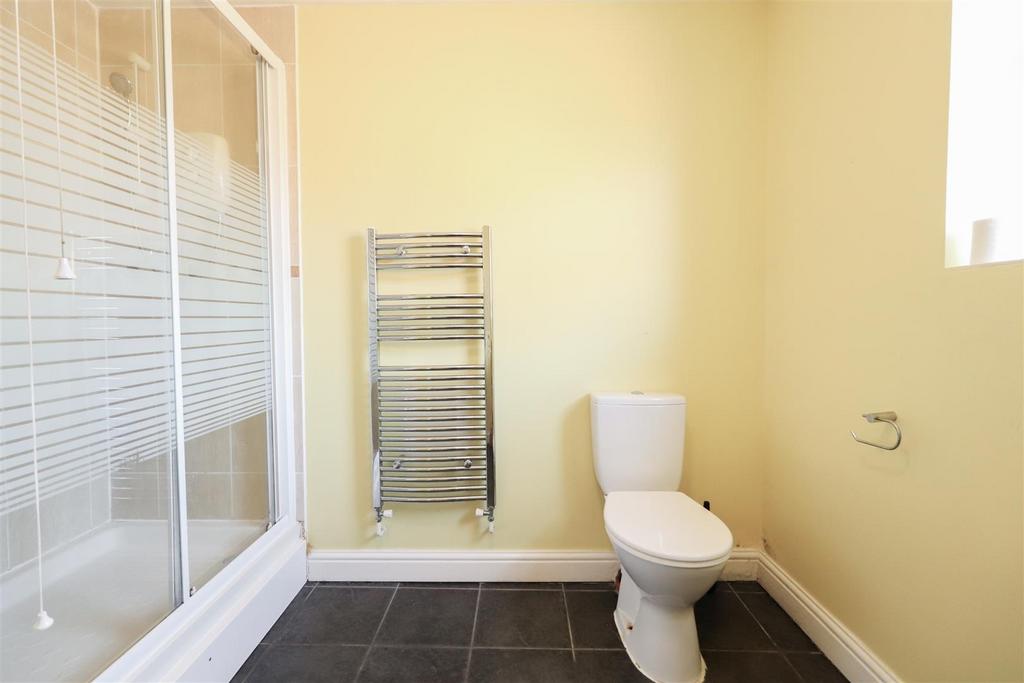 Bright modern bathroom with shower and heated r...