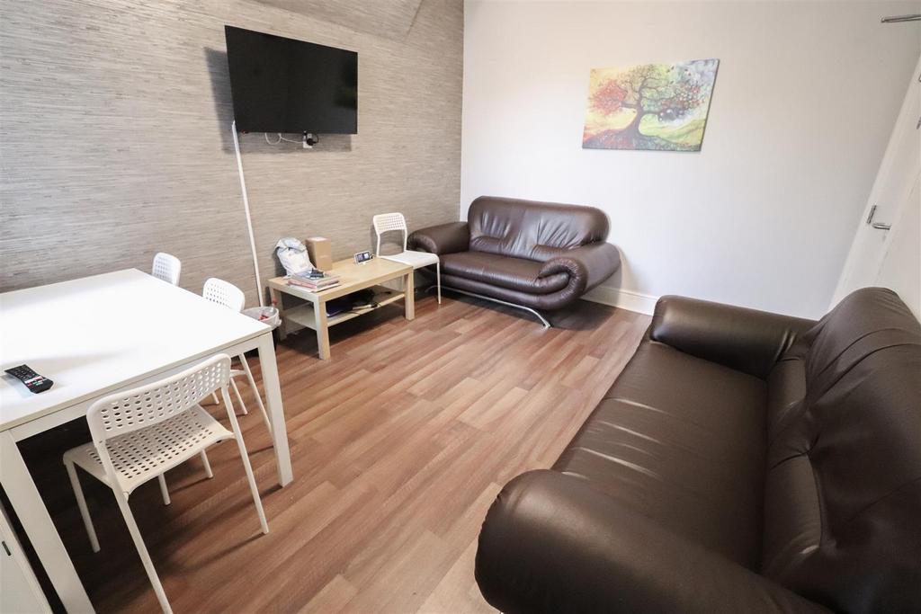 Bright furnished living room with dining space...