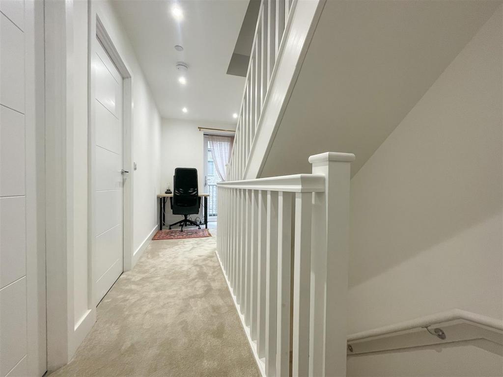 Stairs rising to third floor landing