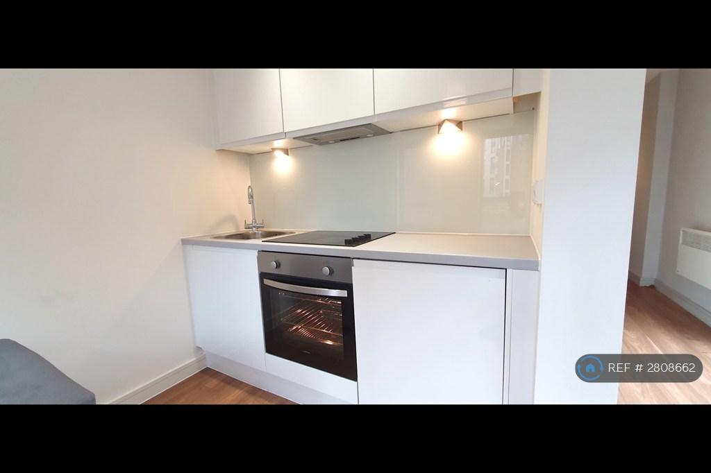 Fitted Kitchen With Fridge And Electric Cooker
