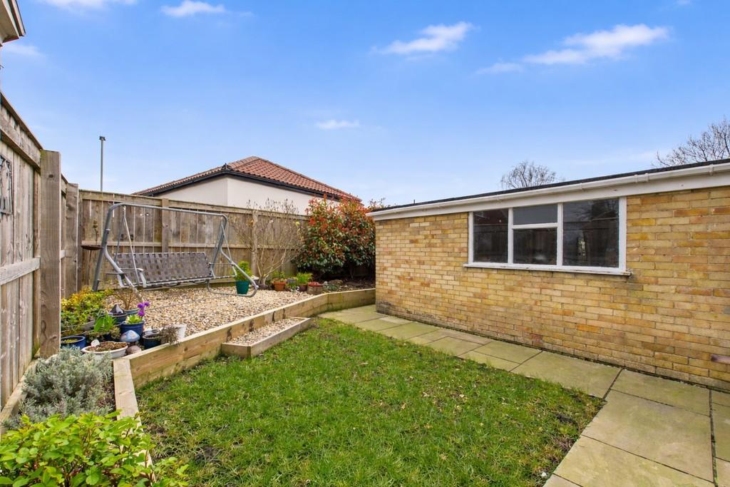 Sunny backyard with brick shed