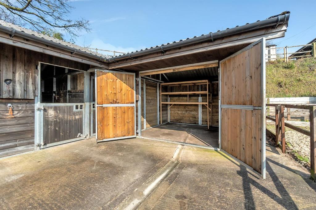 Hay barn or store room for stables beside arena
