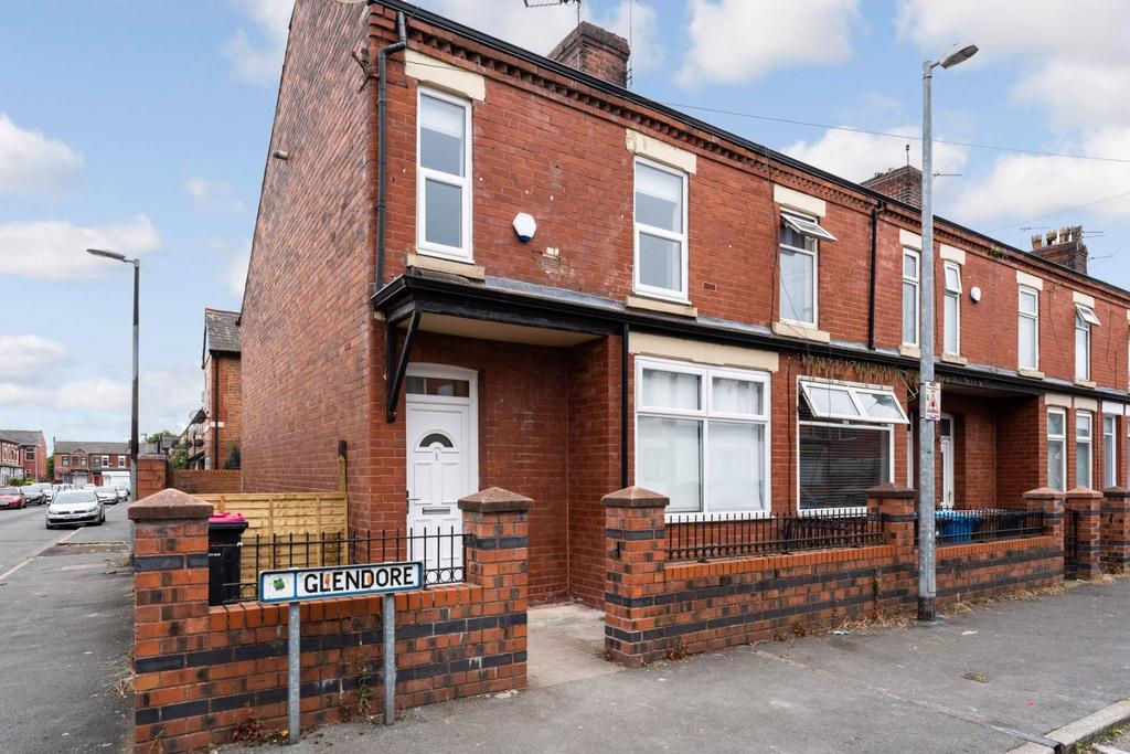 Red-brick end-terrace with bay window and small...