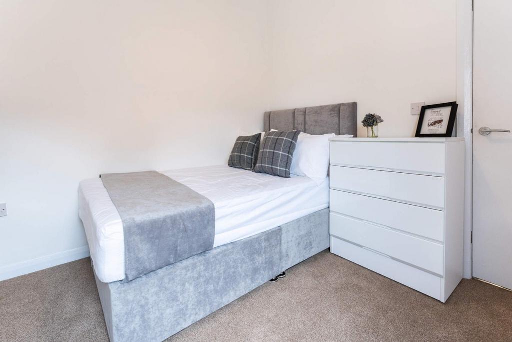 Neat single bedroom with fitted bed and chest...