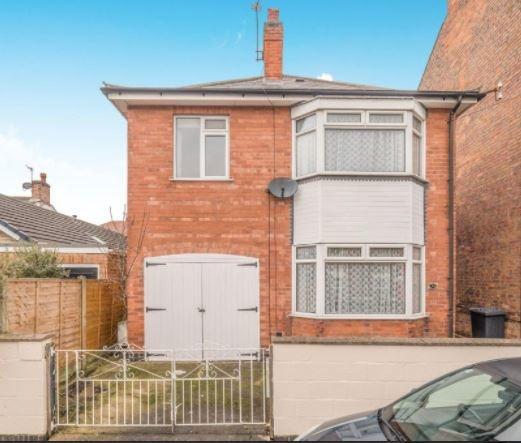 Detached two-storey house with bay window and y...