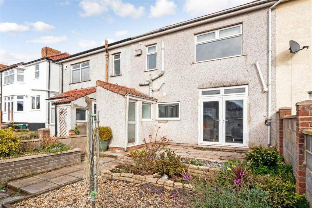 Low-maintenance private rear garden with patio...