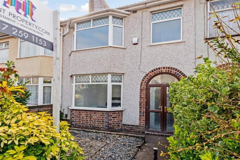 Attractive terraced house front with bay window...