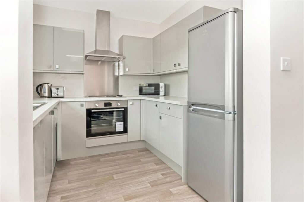 Modern fitted kitchen with appliances...