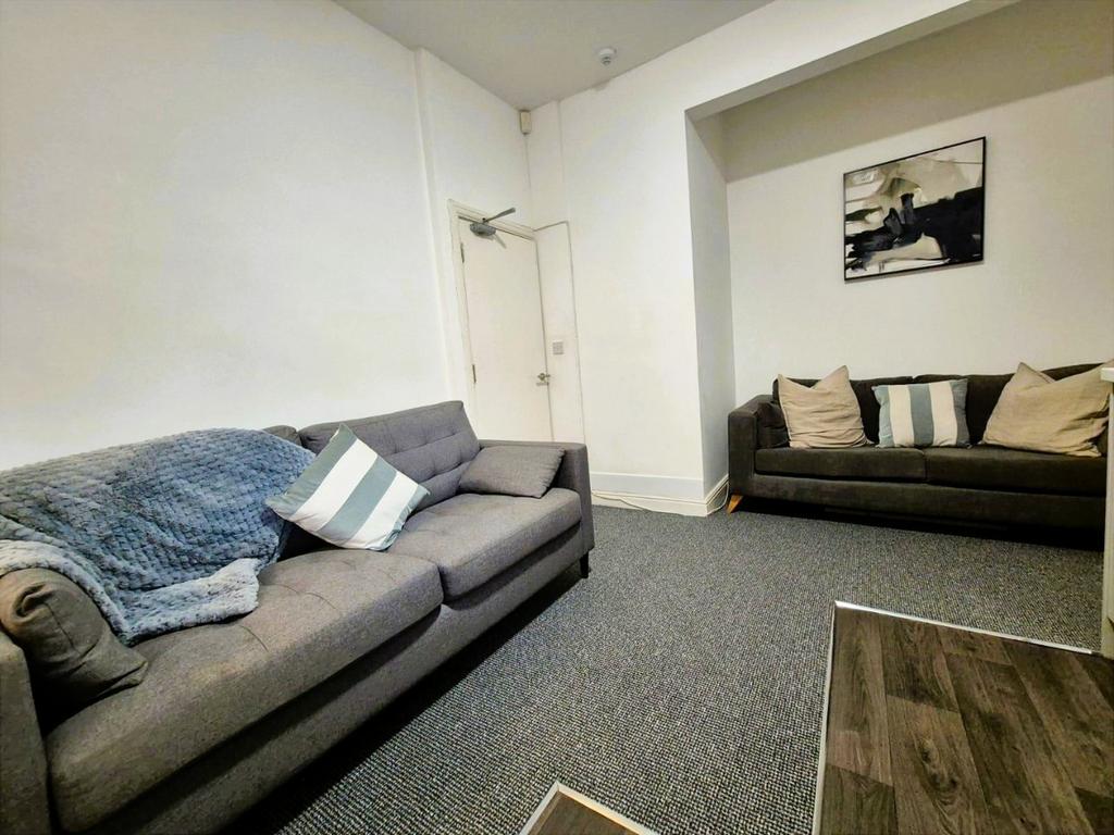 Comfortable lounge with sofas and wall art...