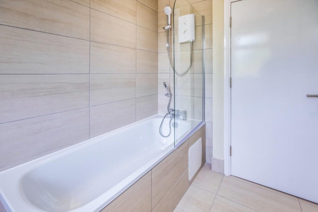 Modern bathroom with bath and shower...