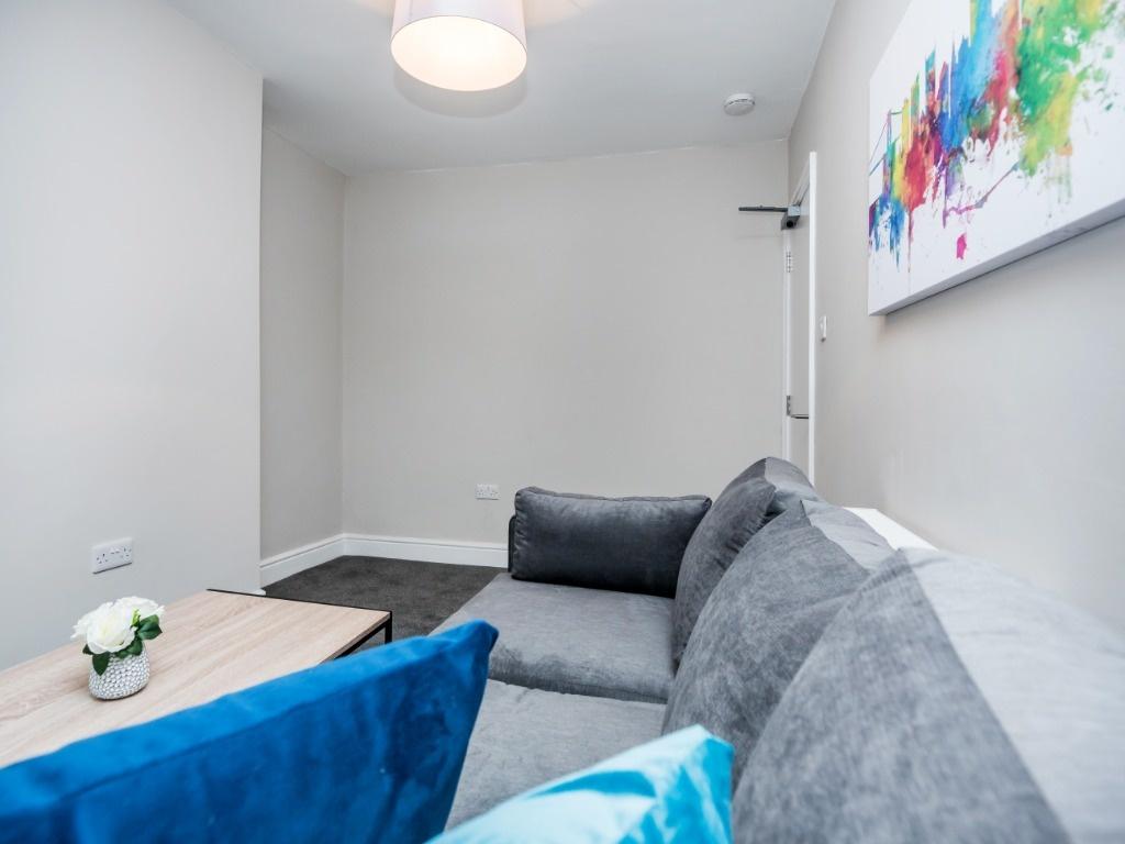 Cosy modern lounge with sofa and artwork...