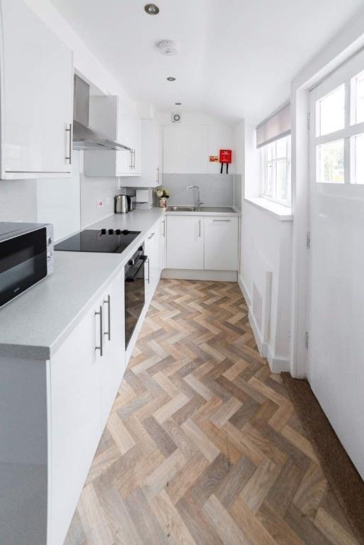 Bright modern galley kitchen with fitted units...