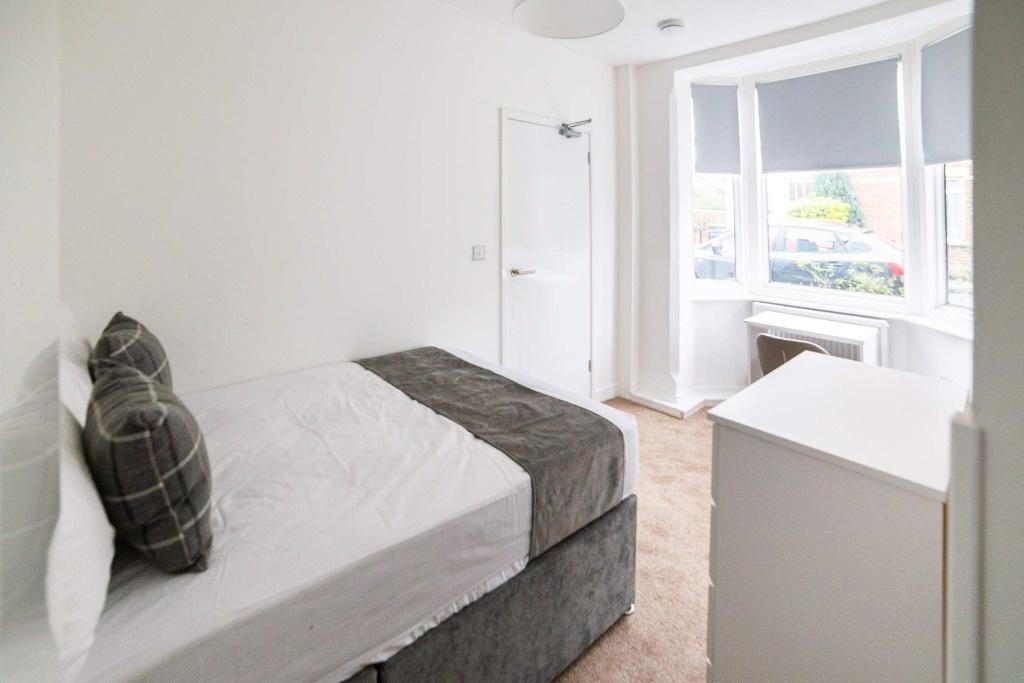 Bright, neat double bedroom with bay window...