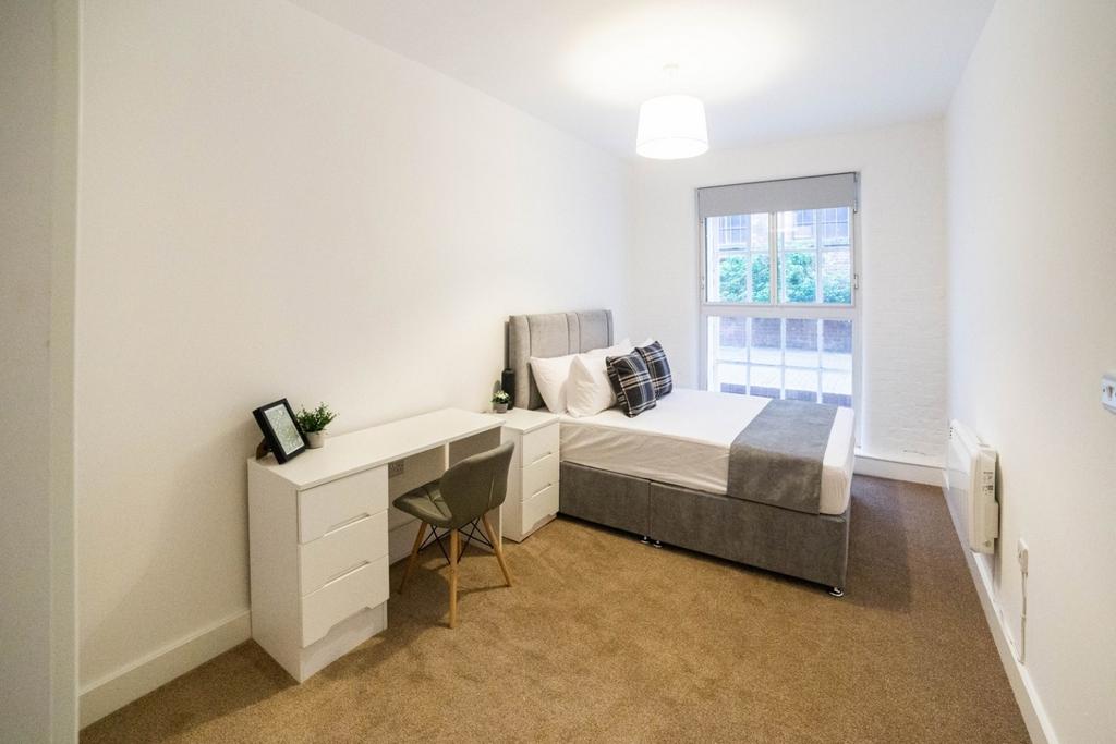 Bright, neat double bedroom with desk and bed...