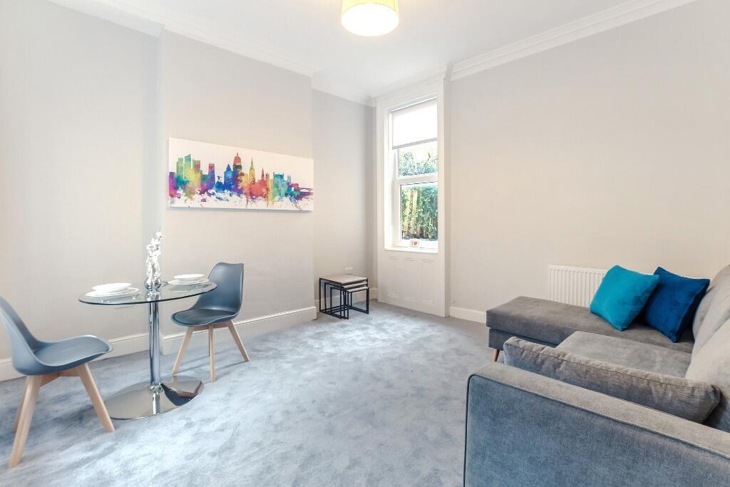 Bright, modern lounge with seating and dining s...