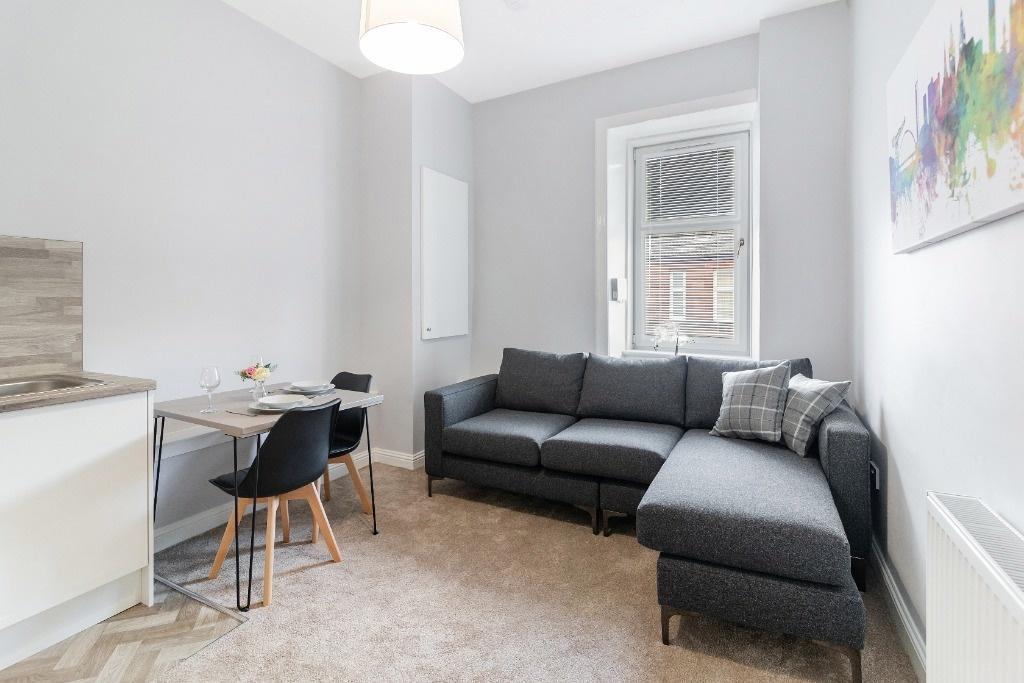 Bright lounge with comfy corner sofa...