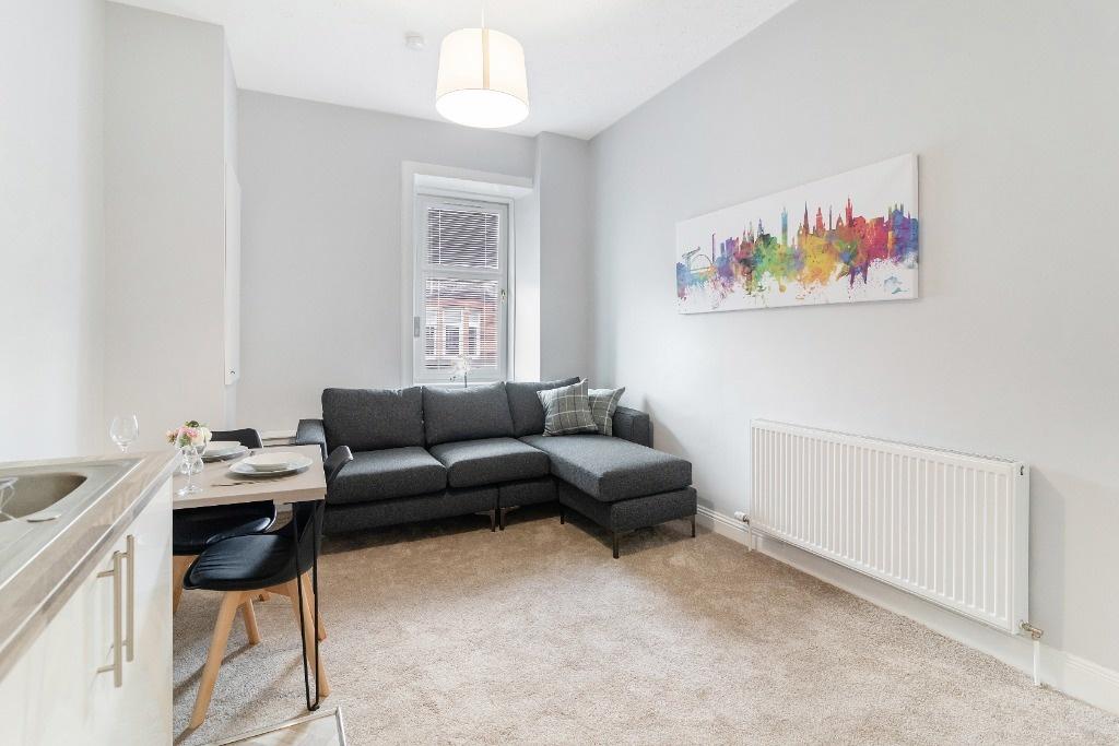 Bright modern lounge with L-shaped sofa...