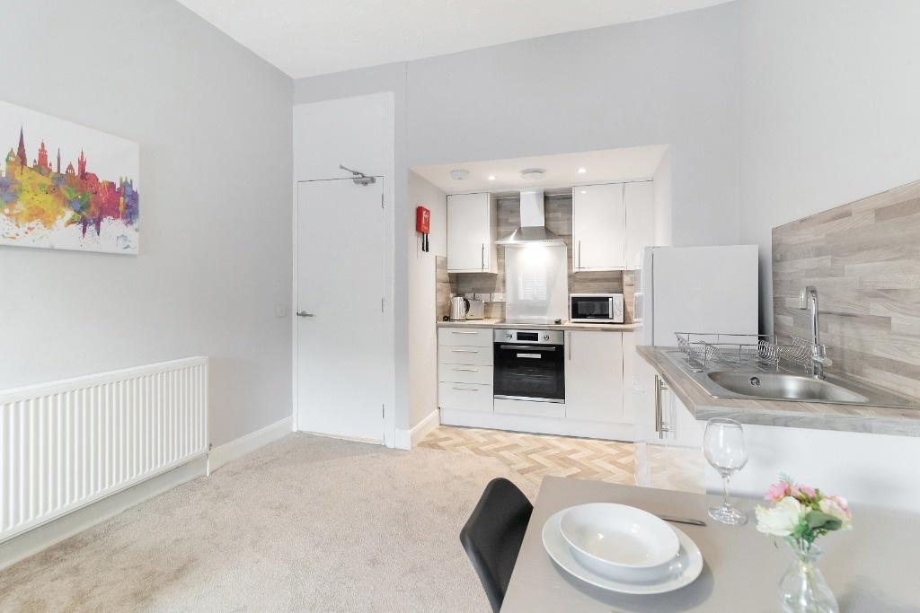 Open-plan kitchen-diner with modern fixtures...