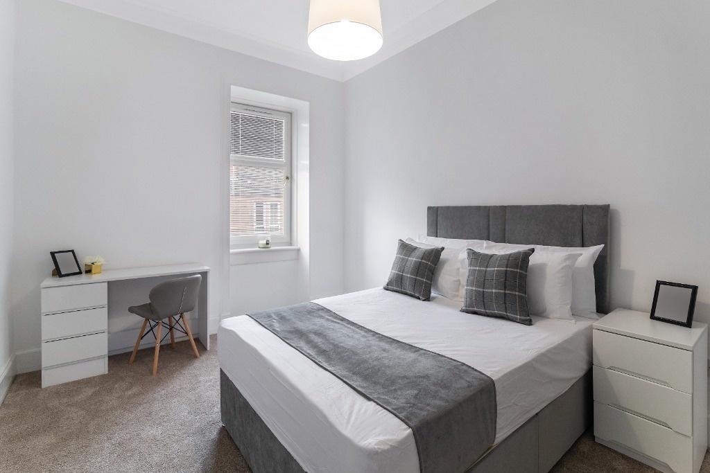 Bright, neatly styled double bedroom with study...