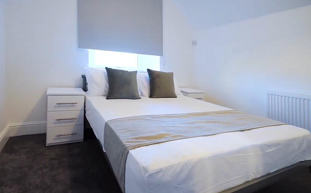 Bright, neatly presented bedroom with neutral D...