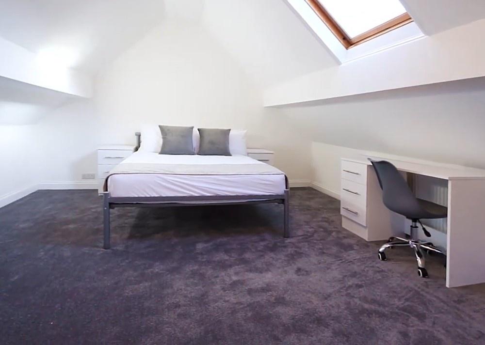 Bright loft double bedroom with desk and skylig...