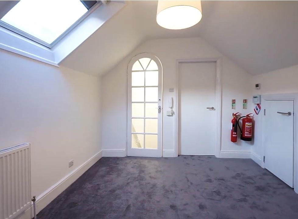 Bright attic double bedroom with skylight...