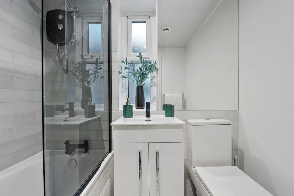 Bright modern bathroom with shower-bath...