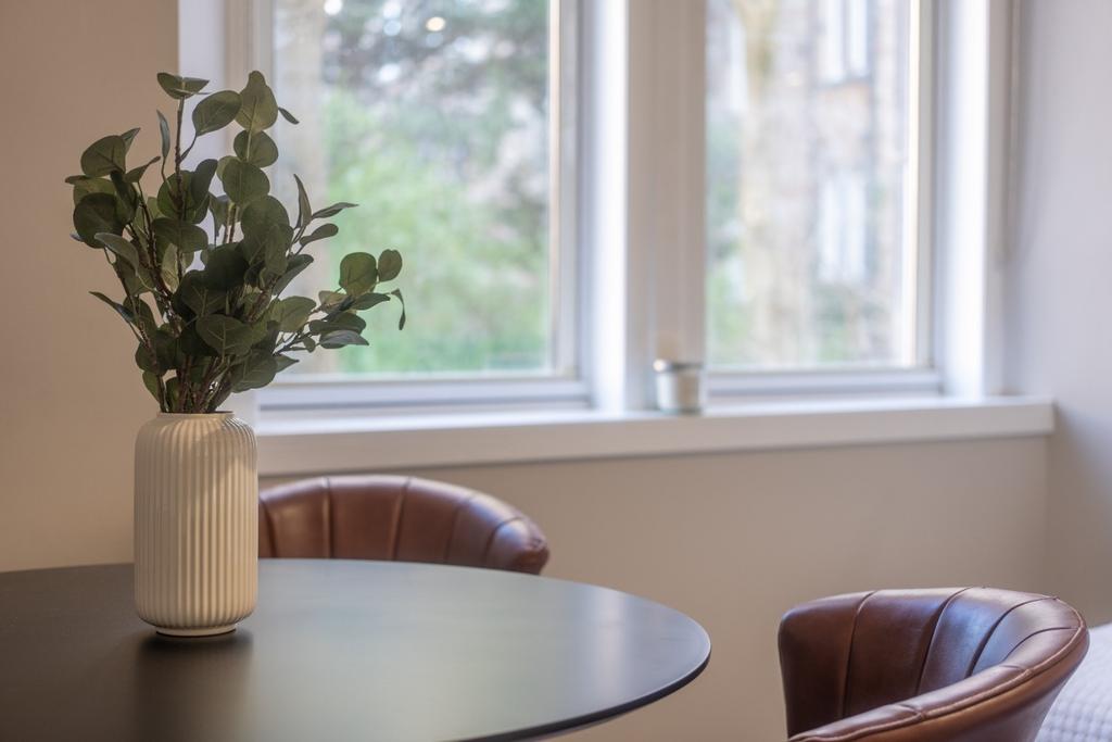 Sunny breakfast table with stylish chairs...