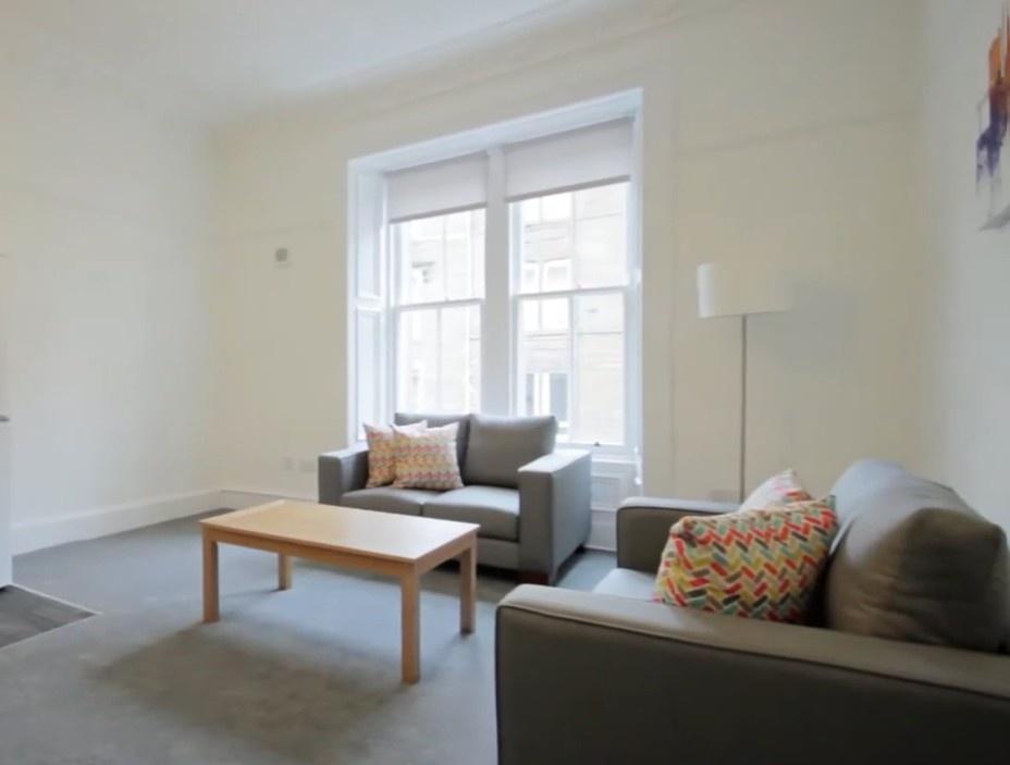 Bright modern lounge with comfy sofas...