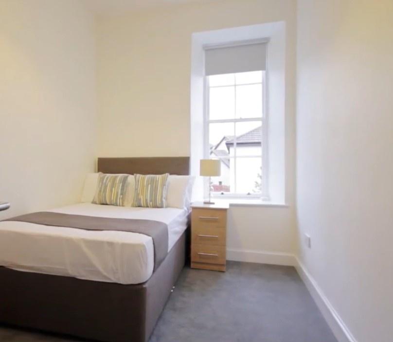 Bright, neatly presented bedroom with comfy bed...