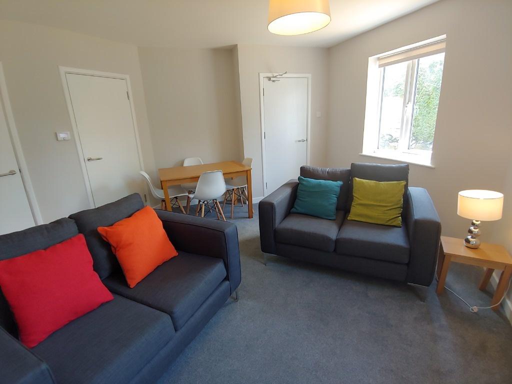 Bright lounge with comfy sofas and dining area...