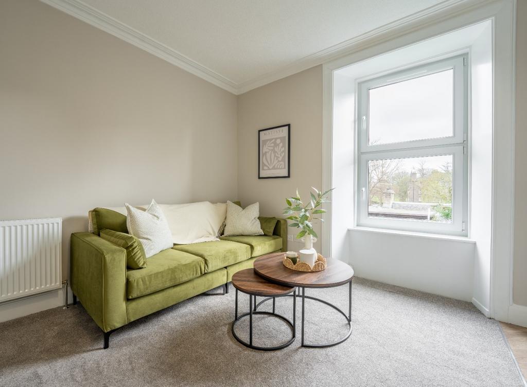 Bright lounge with comfy sofa and neat décor...