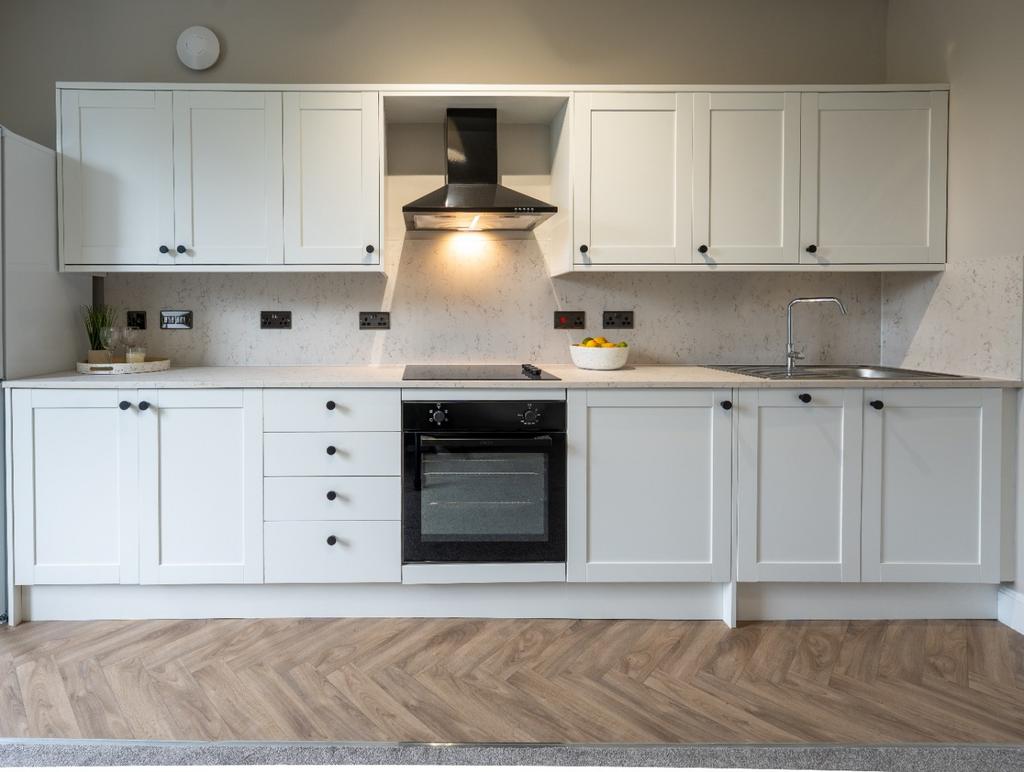 Modern fitted kitchen with ample storage...