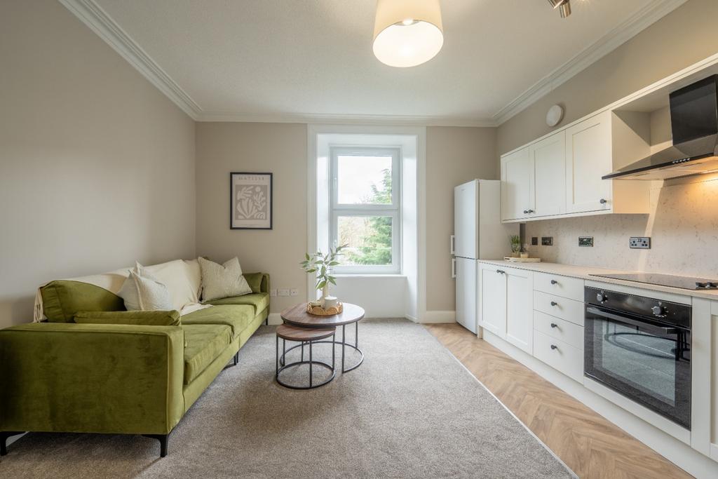 Bright open-plan lounge with kitchenette...