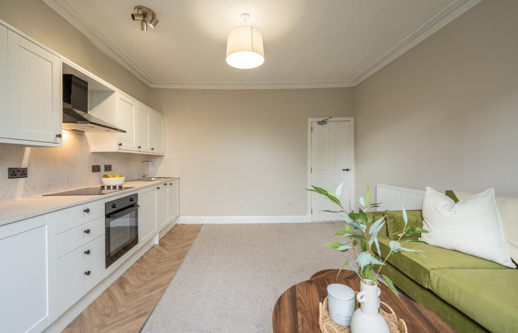 Bright open-plan living area with kitchenette...