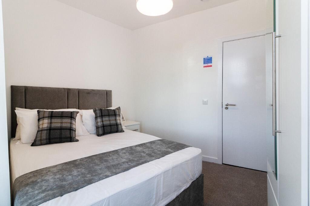 Bright double bedroom with modern neutral decor...