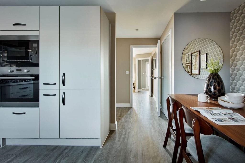 The open-plan kitchen/diner serves as the...