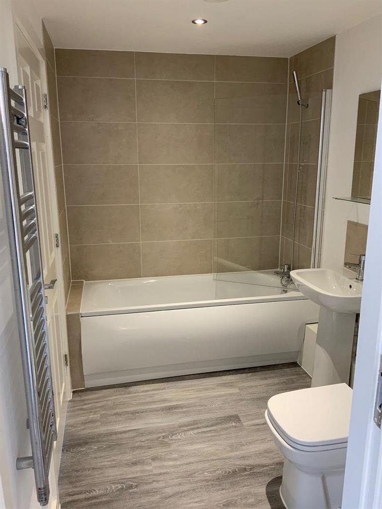 Modern bathroom with bath and shower...