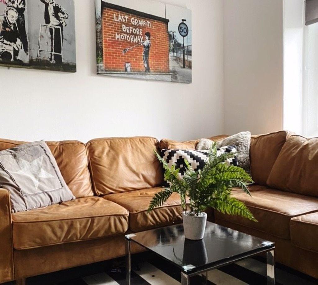 A spacious and stylish living room featuring a ...