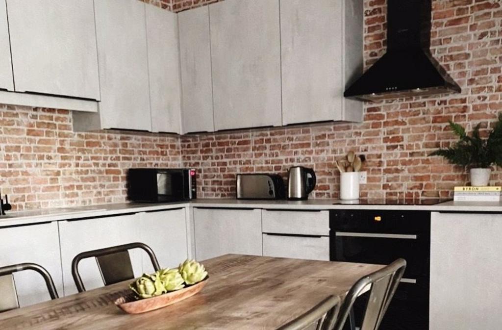 Modern kitchen with ample countertop space, a s...