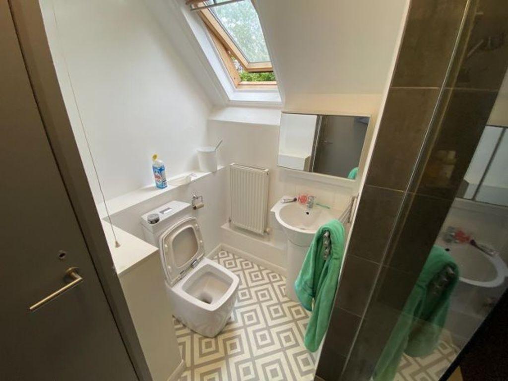A modern, well-maintained bathroom with a large...