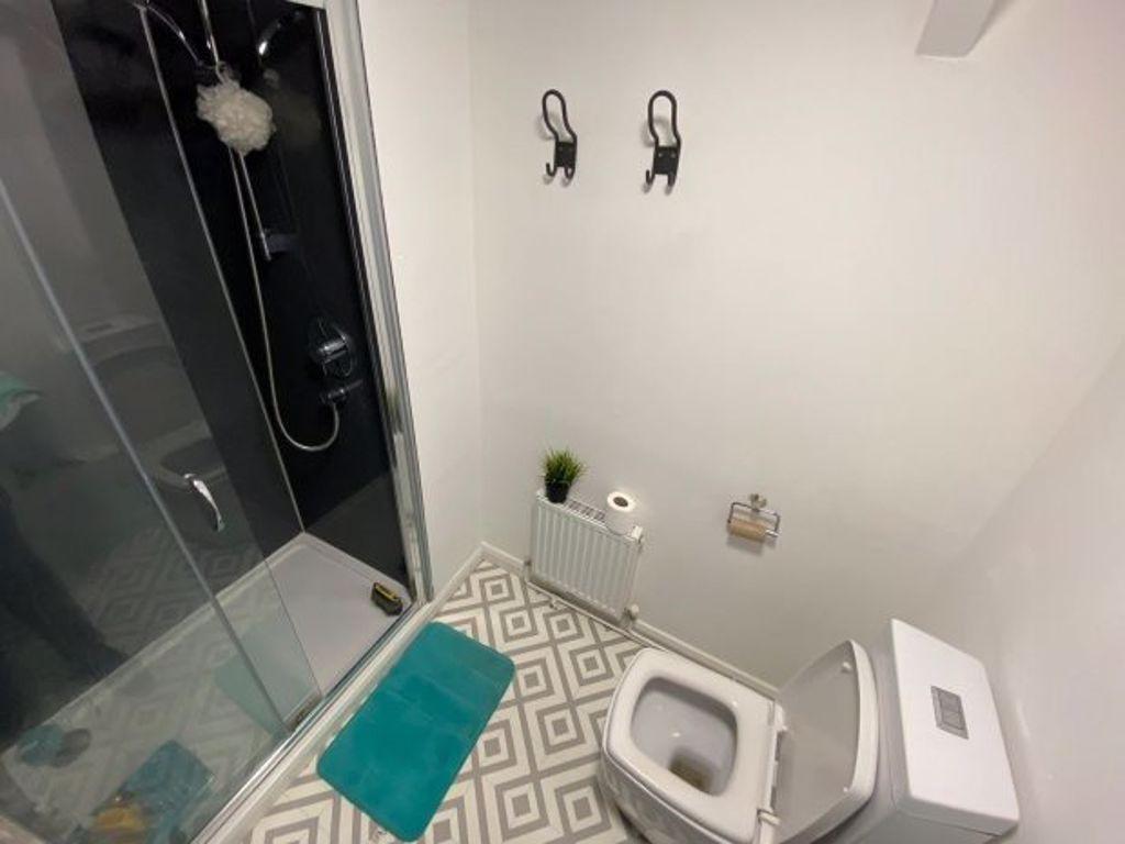 A clean and well-maintained bathroom featuring ...