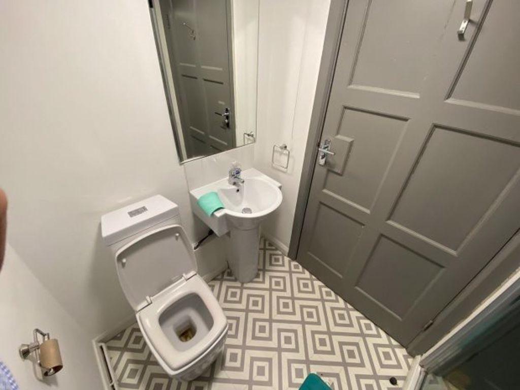 A clean and well-maintained bathroom with moder...